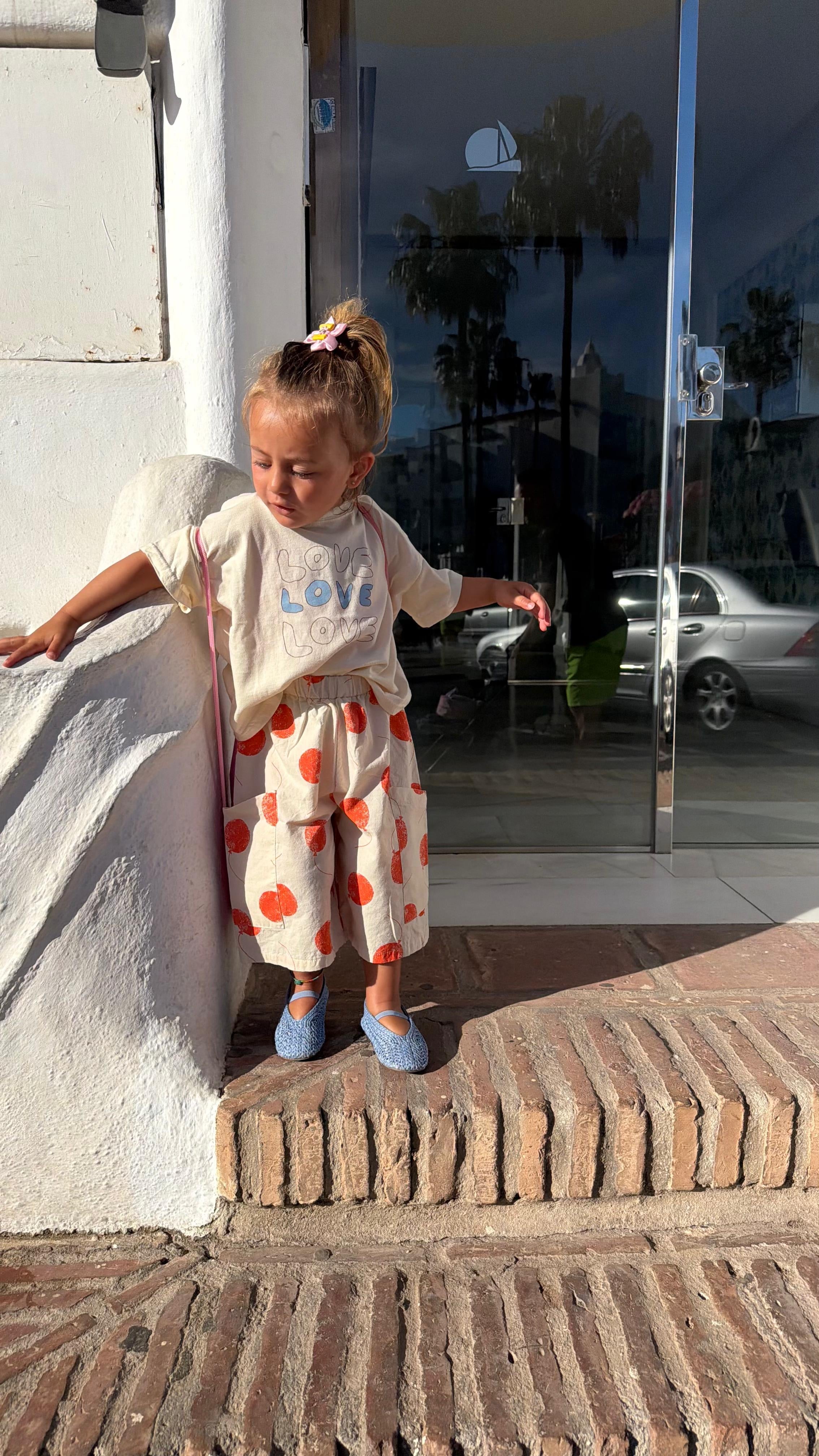 PANTALONE CON PALLONCINI ARANCIONI